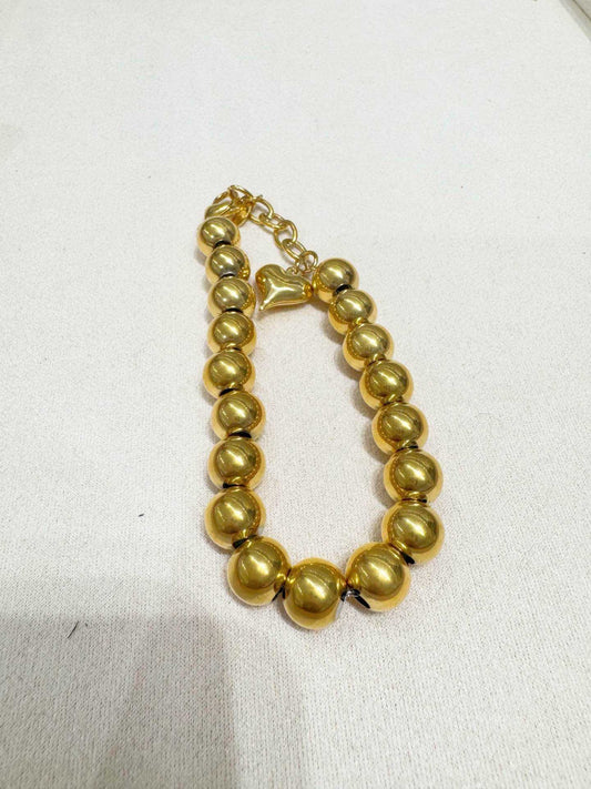 Braccialetto  con sonaglio sfera e cuoricino